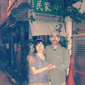 Mr. Kim and his wife outside their restaurant, Min Ga in Busan's PNU area