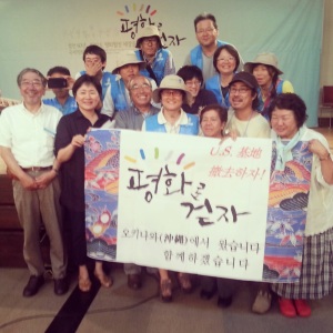 Activists from Osaka pose in solidarity with members of the International Peace March group